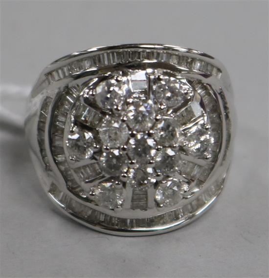 A diamond and 9ct white gold cluster ring